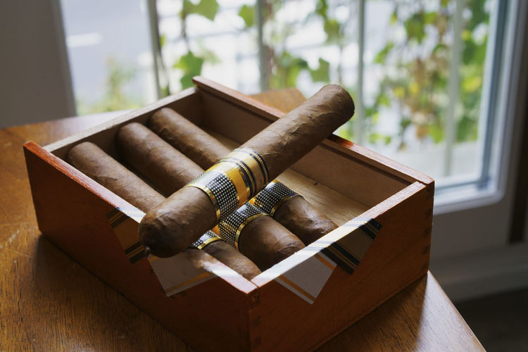 High angle view of cigars on table