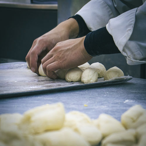 Cropped hand of person preparing food. bakery. dough. pastry