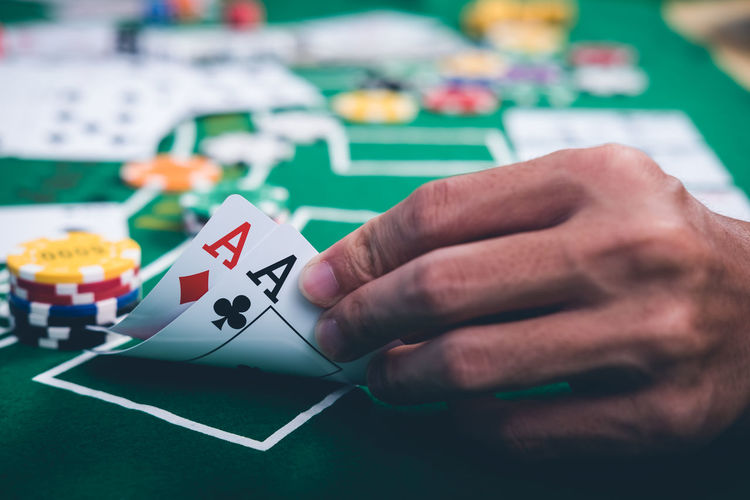Close-up of man playing poker