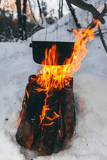 Close-up of camp fire in snow