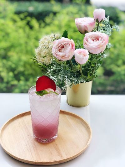 Rose soda on a wooden tray