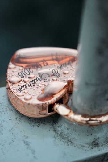 Close-up of love lock on railing