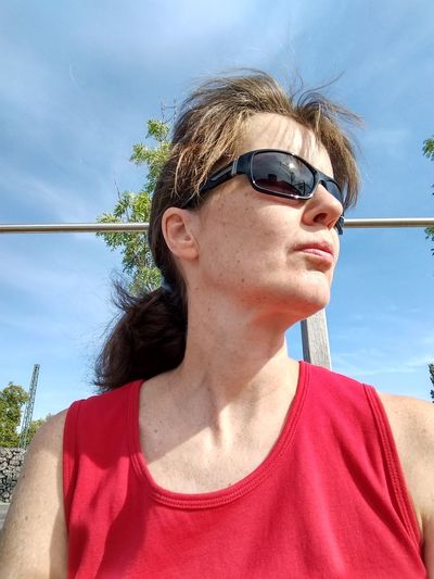 Woman wearing sunglasses against sky
