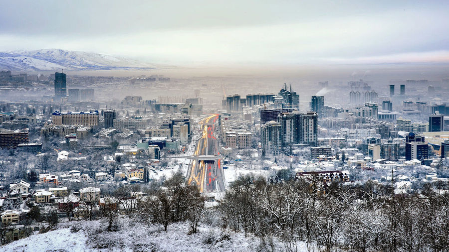 Cityscape with mountain range in background
