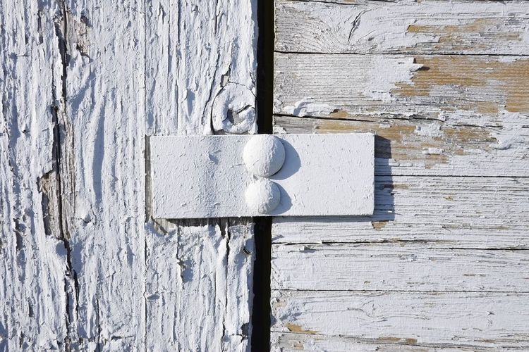 Close-up of door knocker on wall