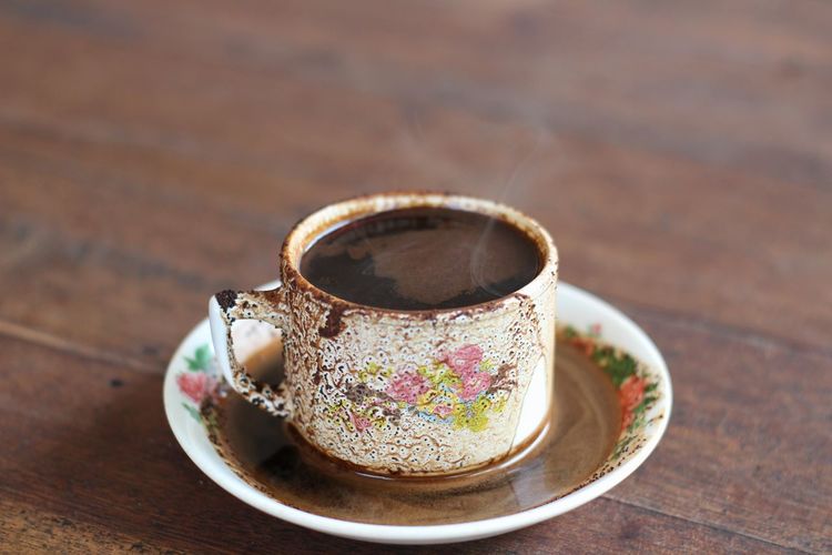 High angle view of coffee cup on table
