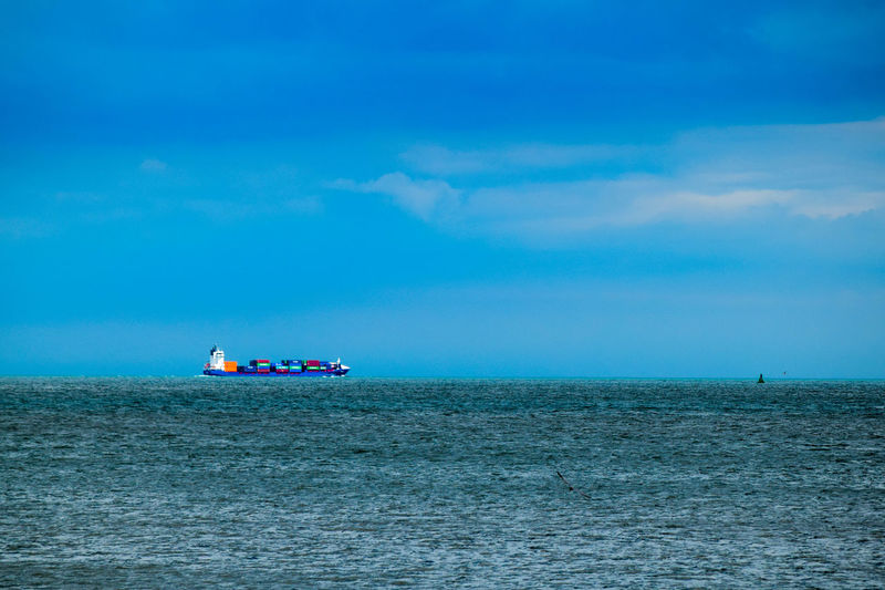 Cargo ship sailing in sea