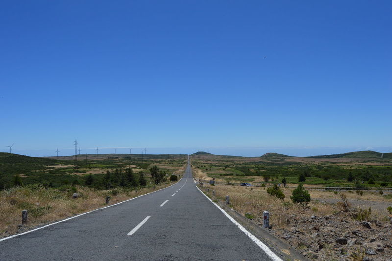 Empty country road along landscape