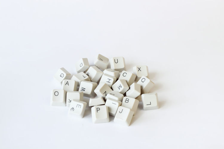 High angle view of computer keyboard against white background
