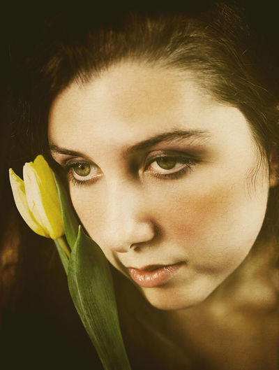 Teenager with tulip in hand ii