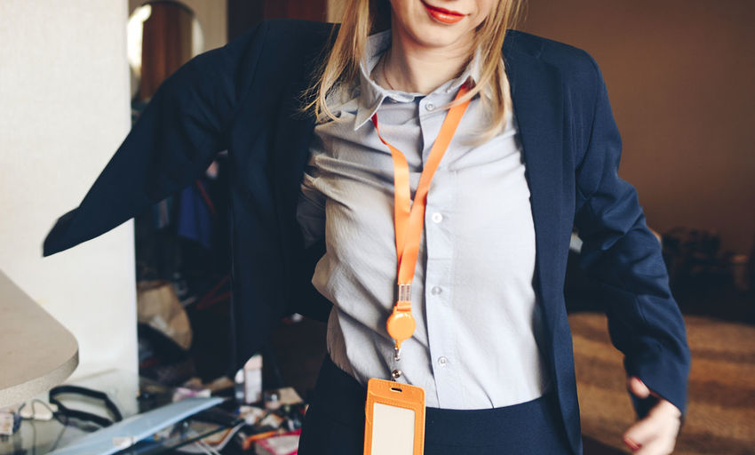 Midsection of businesswoman standing at office
