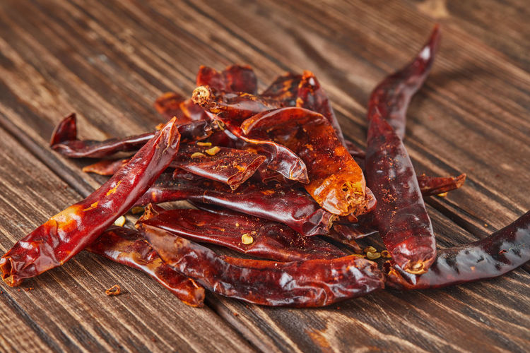 Dried red hot pepper on wooden vintage background