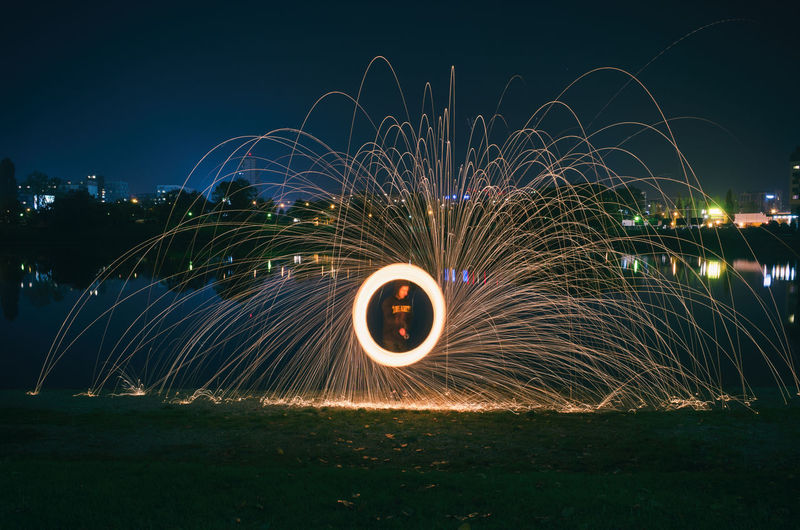 Light trails against sky at night
