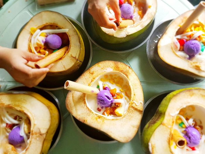 Directly above shot of hands decorating food