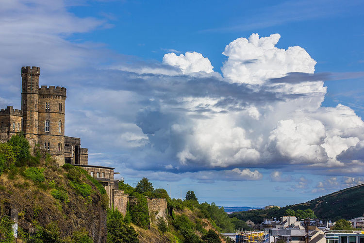 Low angle view of edinburgh castle against cloudy sky
