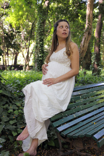 Young pregnant woman in the park