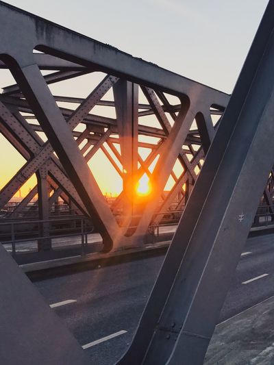 Bridge against clear sky at sunset