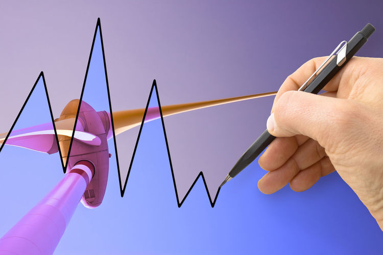 Digital composite image of cropped hand drawing line graph