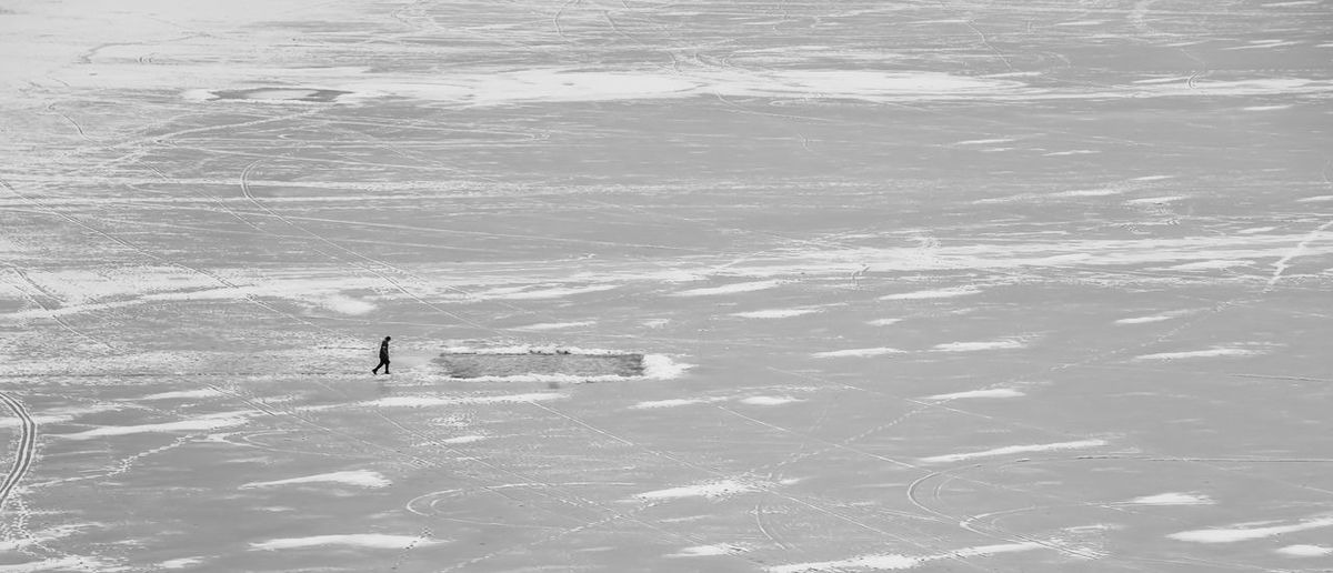 Ice skating on a frozen lake in winter