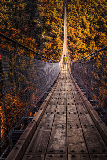 Footbridge over railroad tracks during autumn