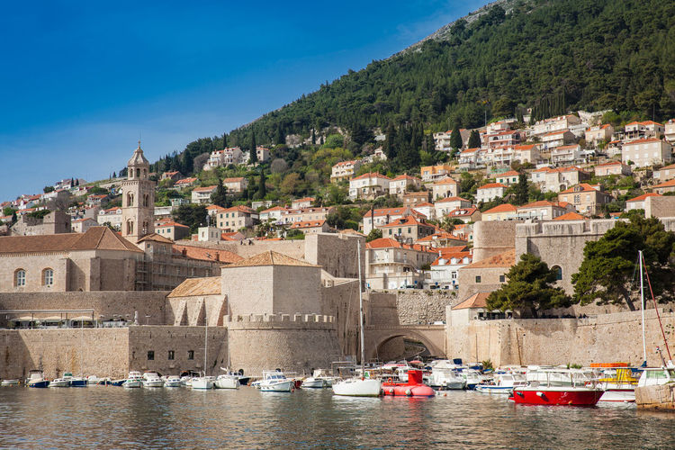 Dubrovnik city old port marina and fortifications seen from porporela