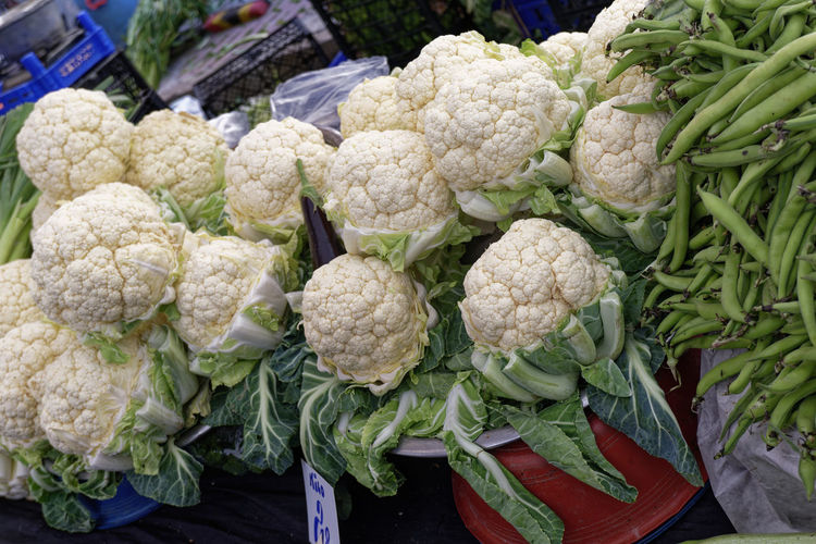 Freshly harvested cauliflower vegetables are sold at the street market