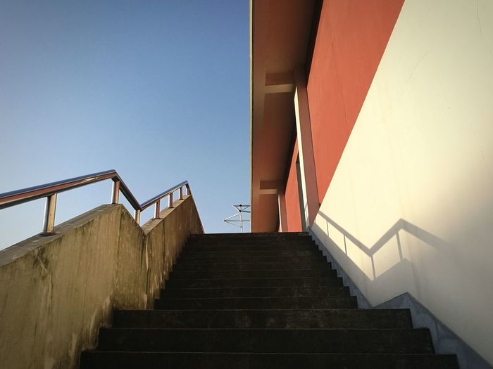 Low angle view of stairs against clear sky