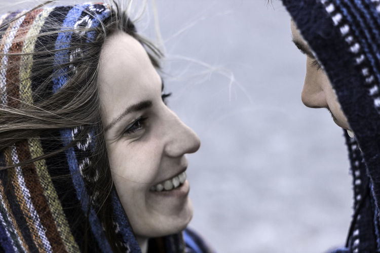 Close-up of couple face to face standing outdoors