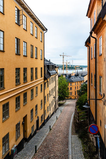 Picturesque street with colorful houses in ugglan quarter in sodermalm, stockholm, sweden
