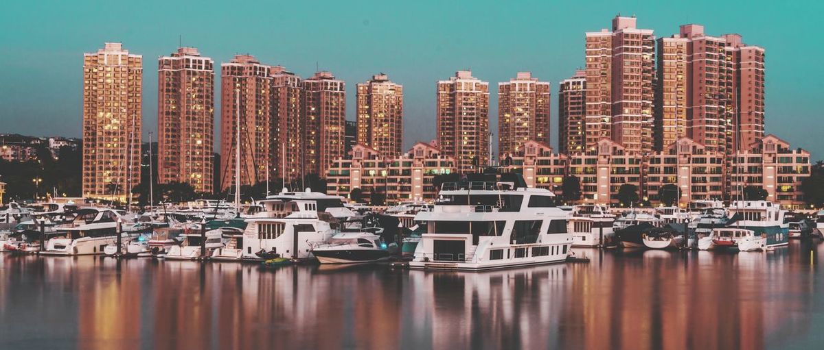 Boats moored at harbor