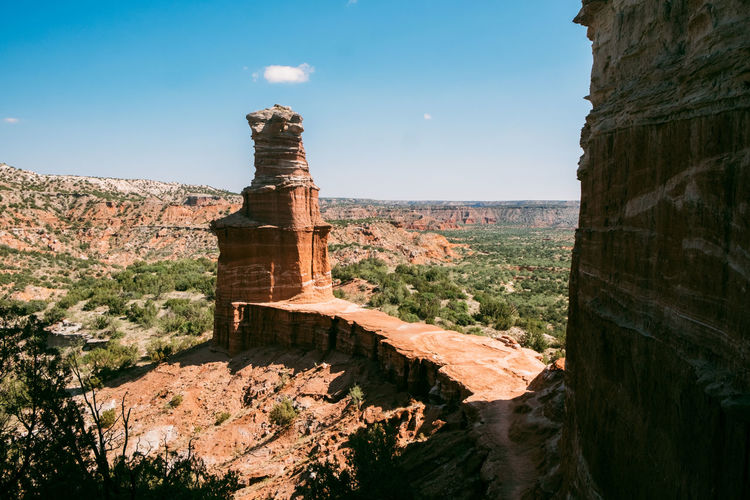Scenic view of rock formation against sky