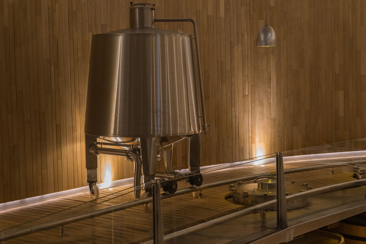 Electric lamps on wooden table against wall at home