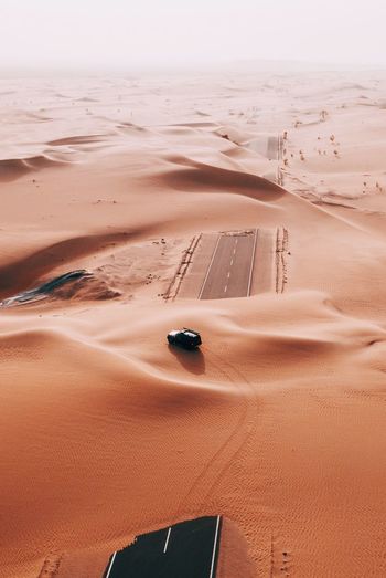 High angle view of sport utility vehicle on at desert