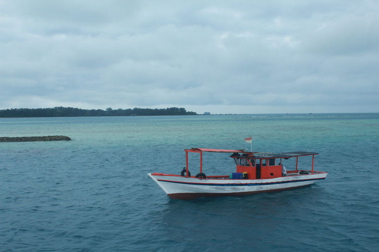 Boat in sea against sky