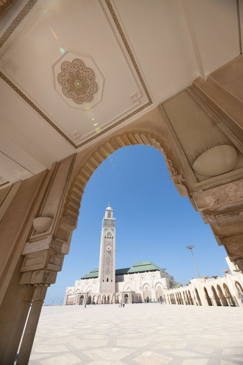 Low angle view of mosque against clear sky