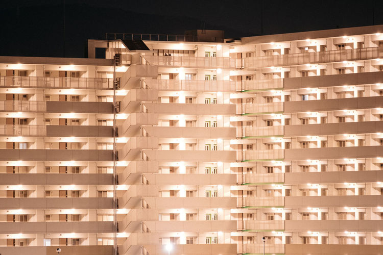 View of apartment building at night
