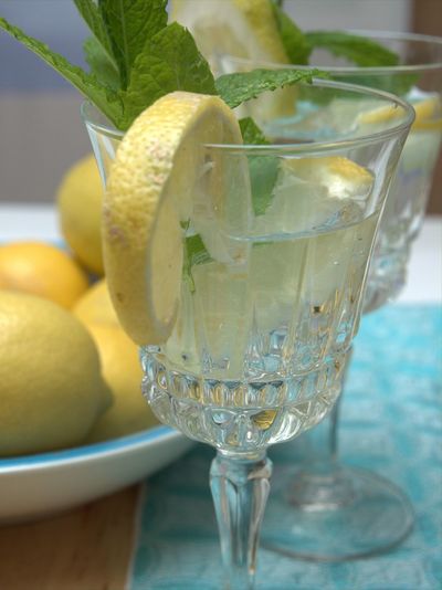 Close-up of lemon in glass on table