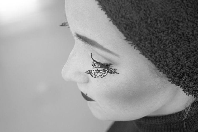 Close-up of young woman with false eyelash