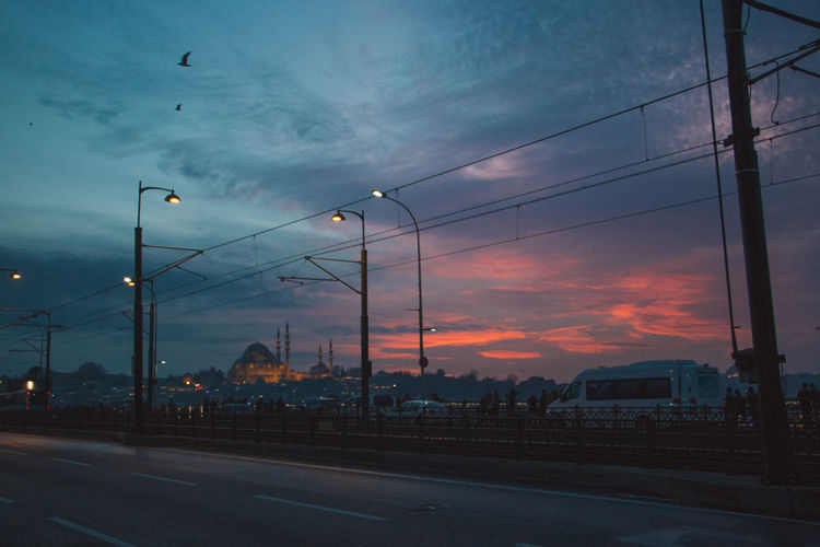 Road against cloudy sky at sunset