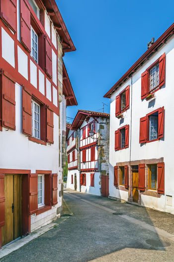 Street with historical houses in espelette, pyrenees-atlantiques, france