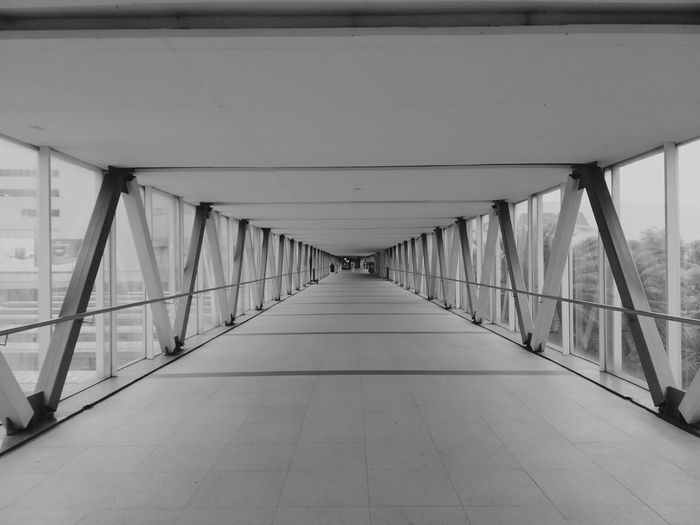 Empty elevated walkway in city