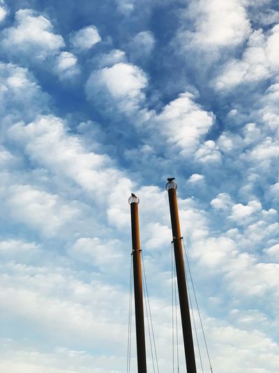 Low angle view of smoke stack against sky