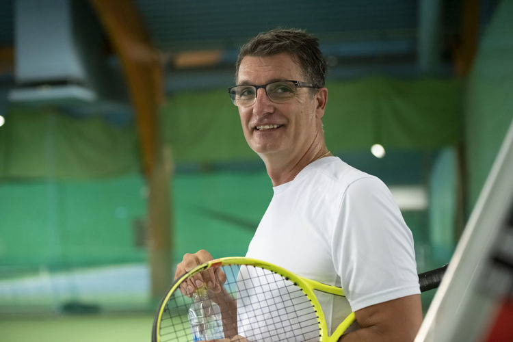 Man holding tennis racquet