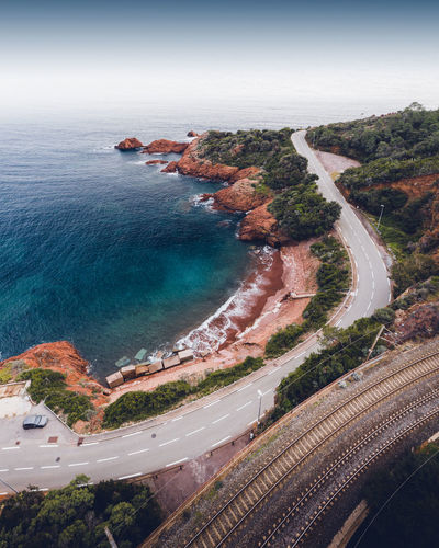 Drone shot over a road and a beach in the french riviera, south of france, provence