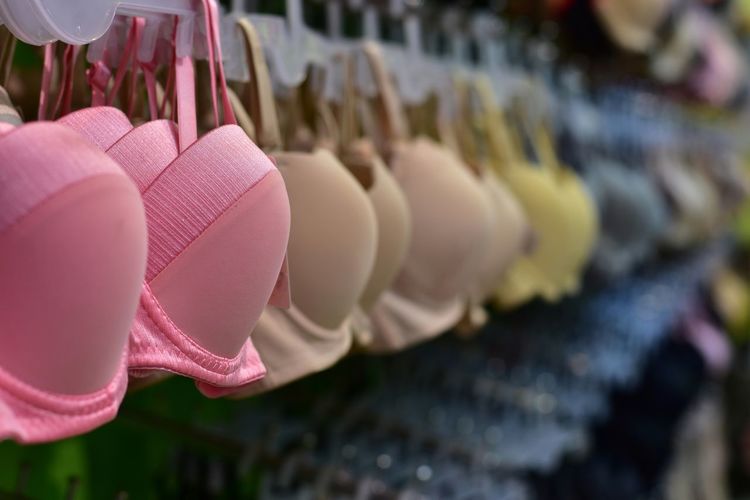 Close-up of bras hanging for sale at market stall