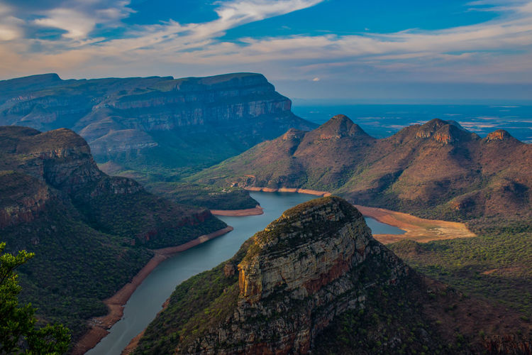 Panoramic view of sea and mountains against sky