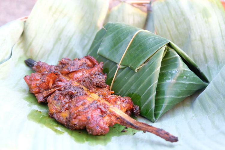 High angle view of meat on leaves