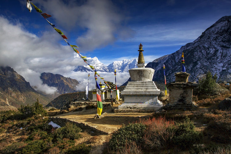 Temple against mountains and sky