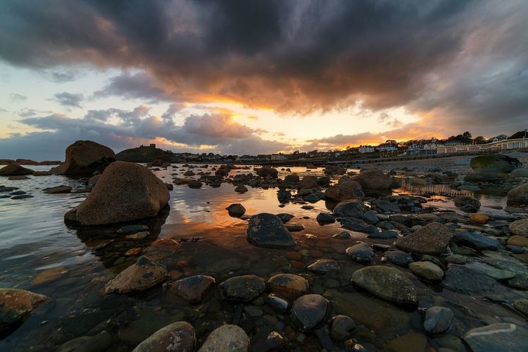 Scenic view of sea against cloudy sky