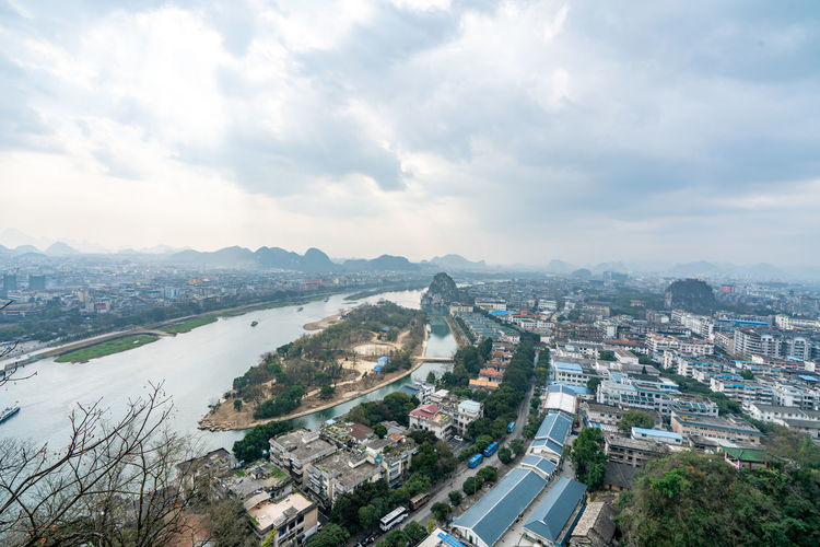 High angle view of river amidst buildings in city